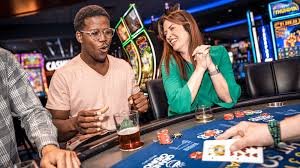 tigerkoin mobile app interface showing sportsbook and live casino options